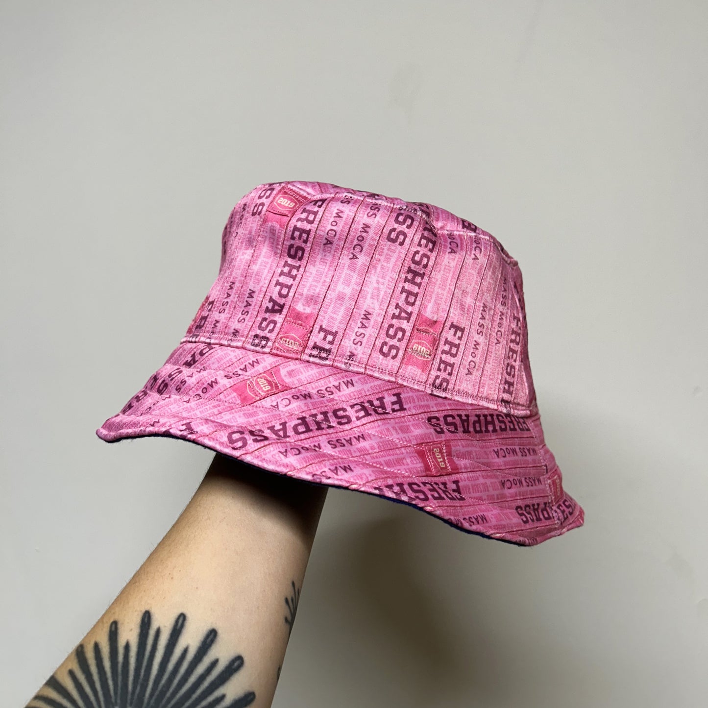 FreshGrass Wristband Bucket Hat: Pink FreshPass w/Purple Lining